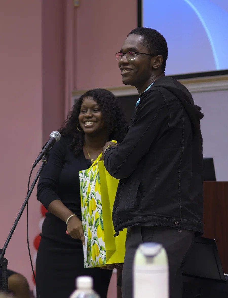 A gift presentation moment after The UWI Marketing Societe launch session.